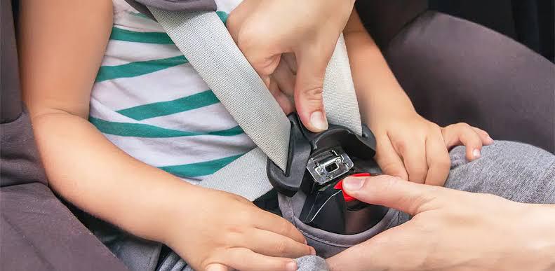Close-up of a correctly tensioned child seat harness